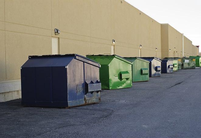 large construction waste containers in a row at a job site in Cedar Valley